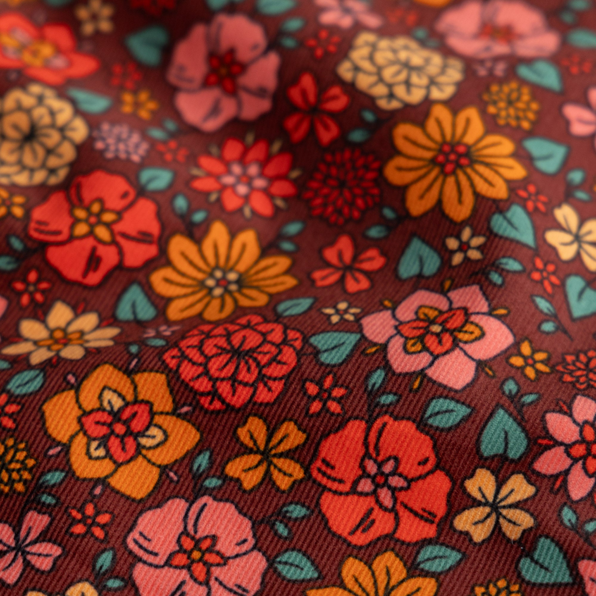 Babycord bloemen beatrice roestbruin/oranje