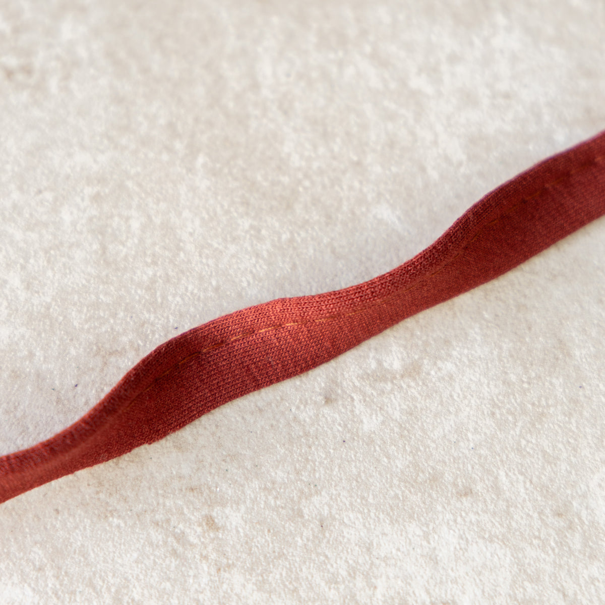 Paspelband jersey 3mm steenrood (057)