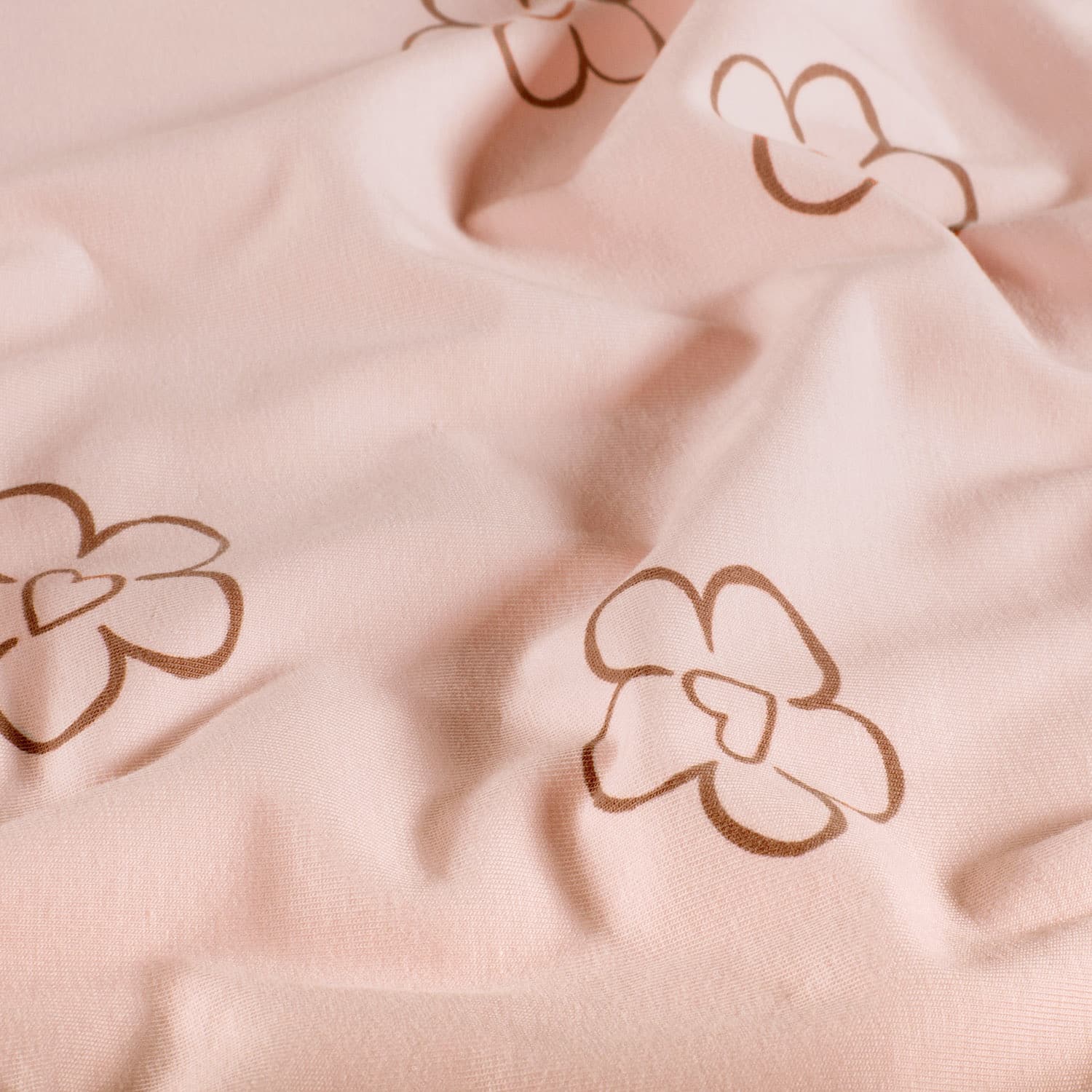 Coupon 125cm jersey bloemen/harten roze