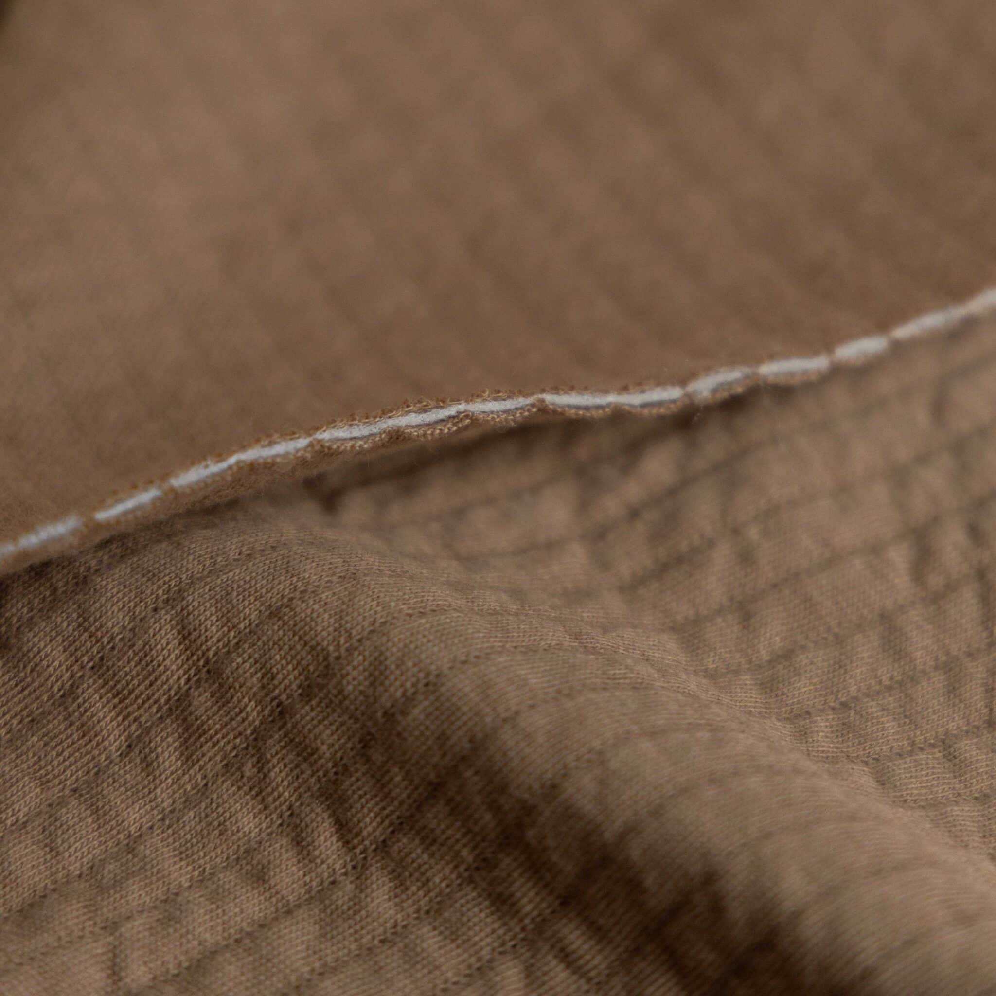 Coupon 150cm quilted jersey donker beige