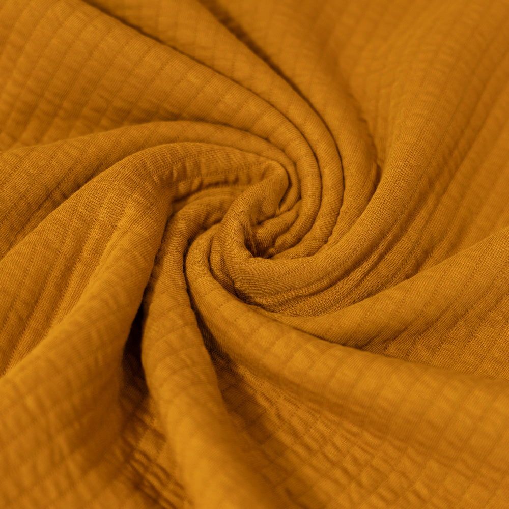Coupon 150cm quilted jersey oker